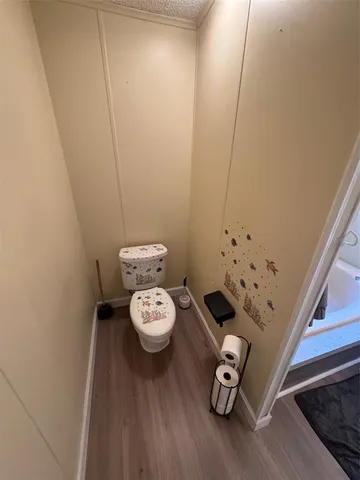 a bathroom with a toilet and a sink
