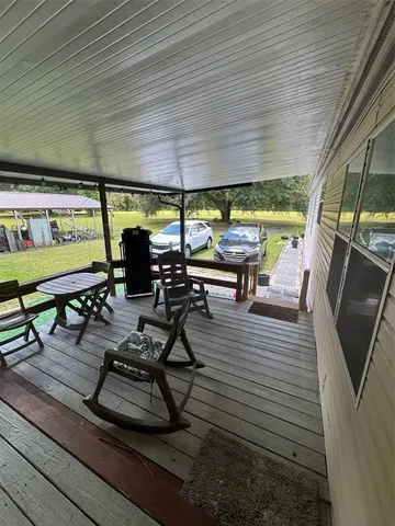 a view of a gym with wooden floor
