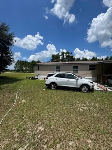 a car parked in the middle of a field