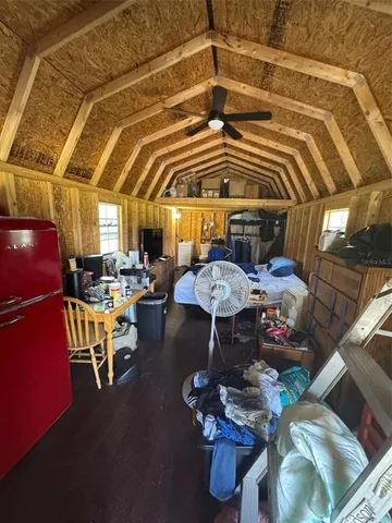 a view of a living room with furniture and a flat screen tv