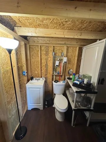 a bathroom with a sink and toilet