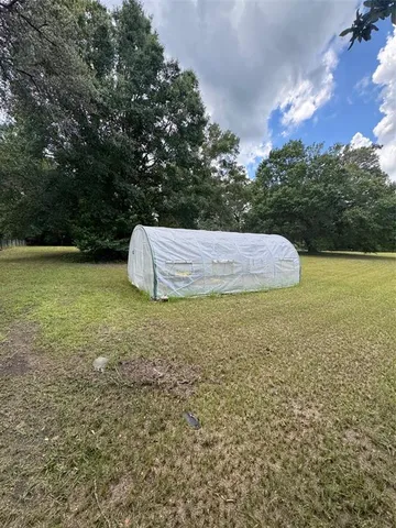 a view of backyard with green space
