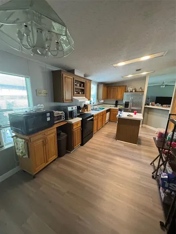 a kitchen with stainless steel appliances granite countertop lots of counter top space