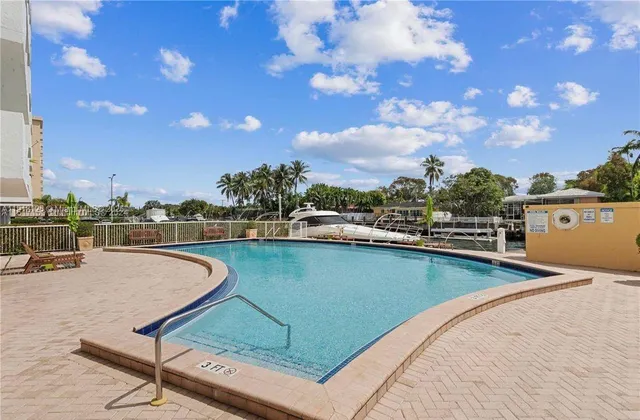a view of a swimming pool with a lounge chairs