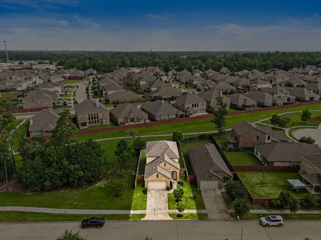 an aerial view of a house with yard swimming pool and outdoor seating