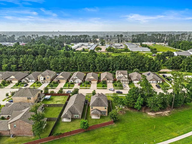 an aerial view of a house with a garden