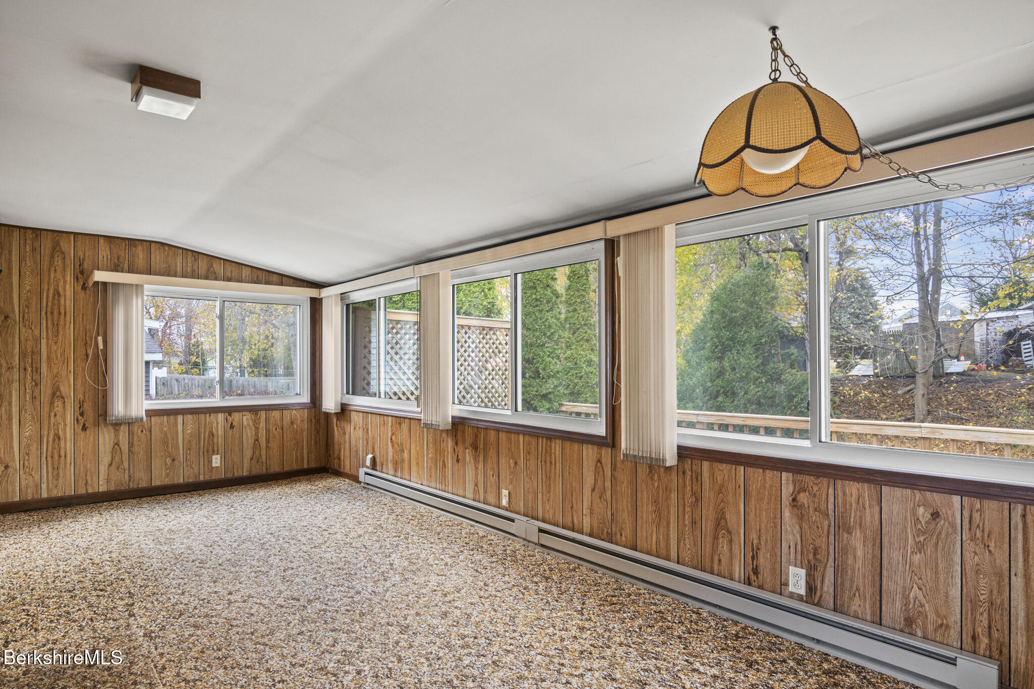 22 Auburn Street Pittsfield, MA 01201 - Photo 8 of 29 a view of an empty room with wooden floor and a window