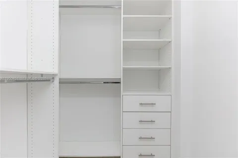 a view of an empty walk in closet