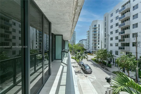 a view of balcony with potted plants