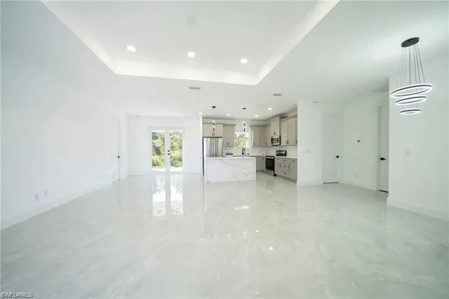 a view of a kitchen with a sink and cabinets