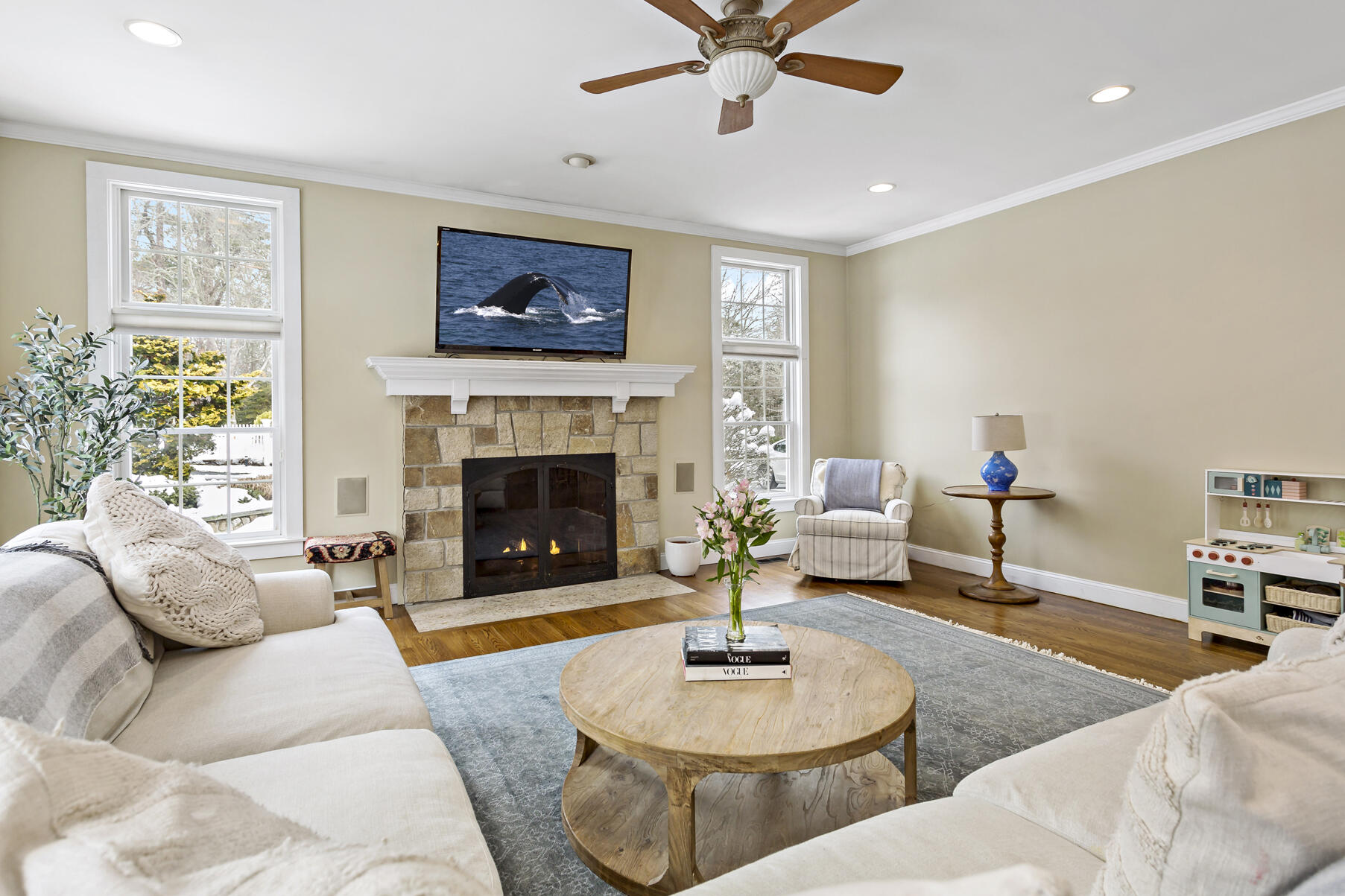 442 Bay Lane Centerville, MA 02632 - Photo 11 of 36 a living room with furniture and a fireplace