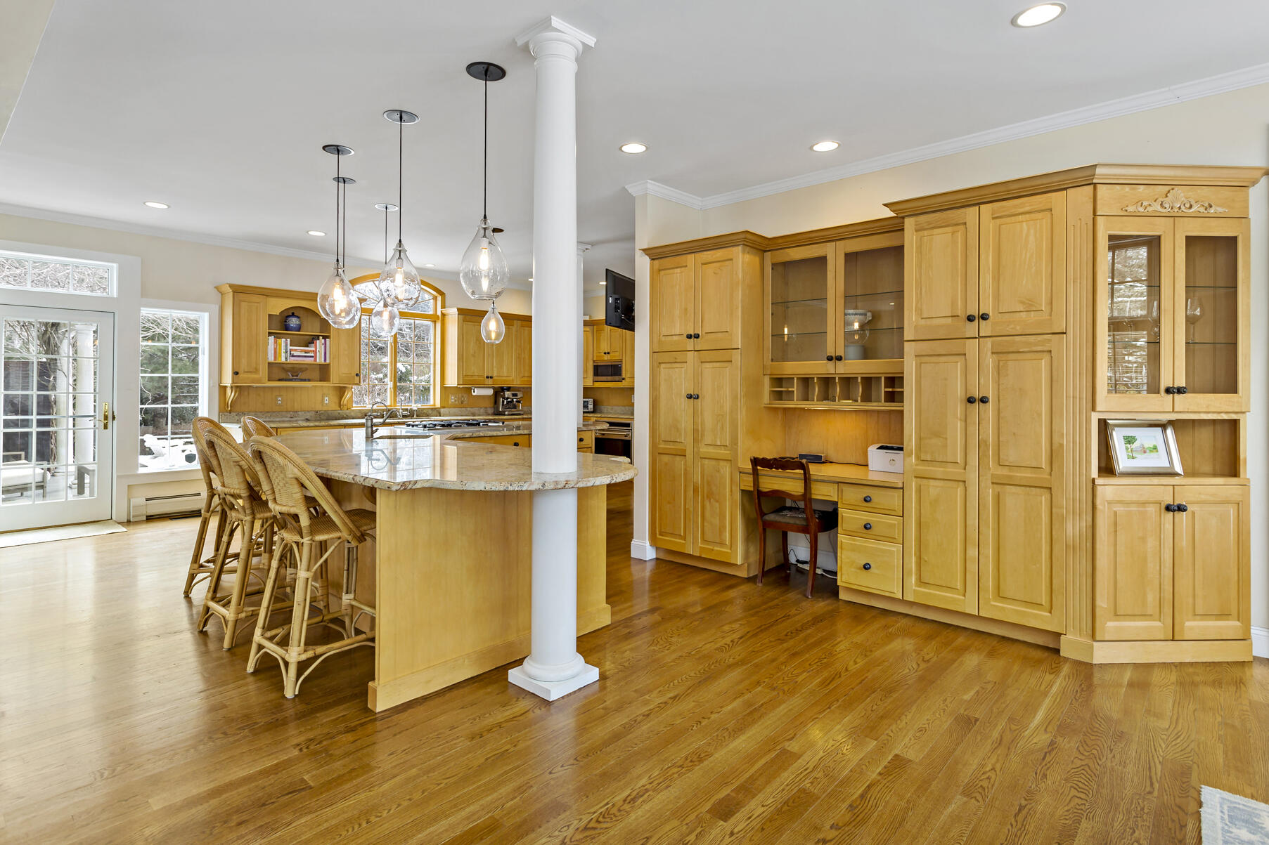 442 Bay Lane Centerville, MA 02632 - Photo 14 of 36 a large kitchen with stainless steel appliances granite countertop a stove refrigerator and a dining table with wooden floor