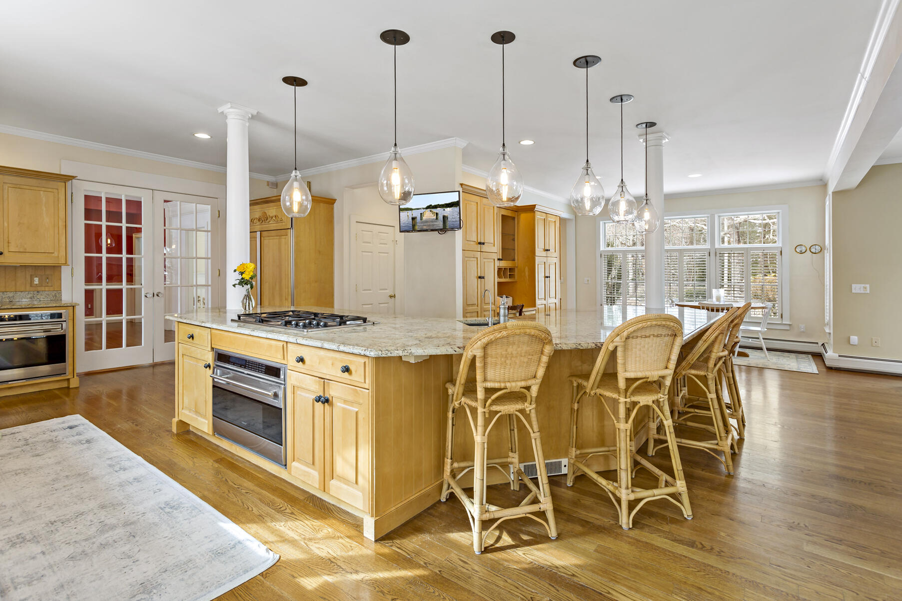 442 Bay Lane Centerville, MA 02632 - Photo 17 of 36 a kitchen with stainless steel appliances granite countertop a stove and a wooden floor