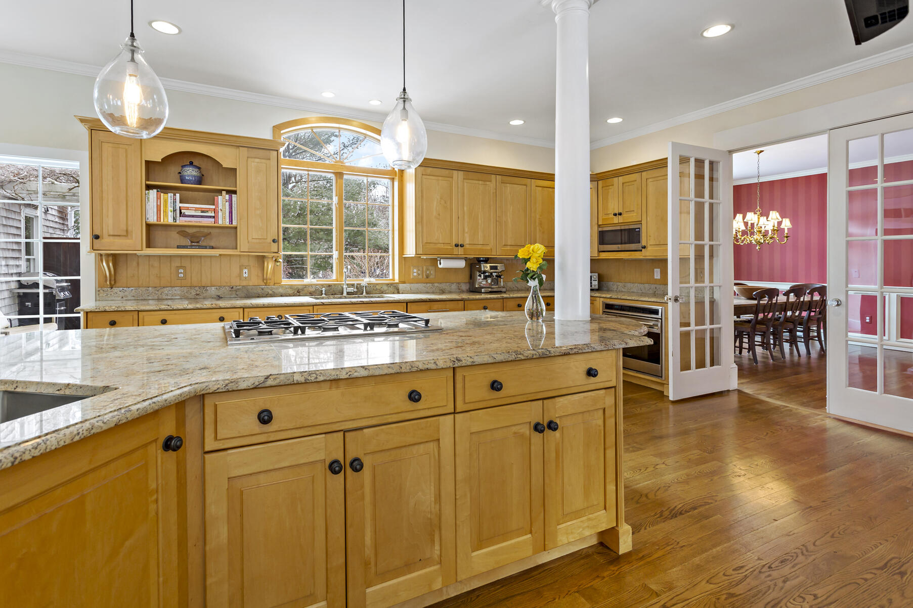 442 Bay Lane Centerville, MA 02632 - Photo 19 of 36 a large kitchen with granite countertop a large window and a sink