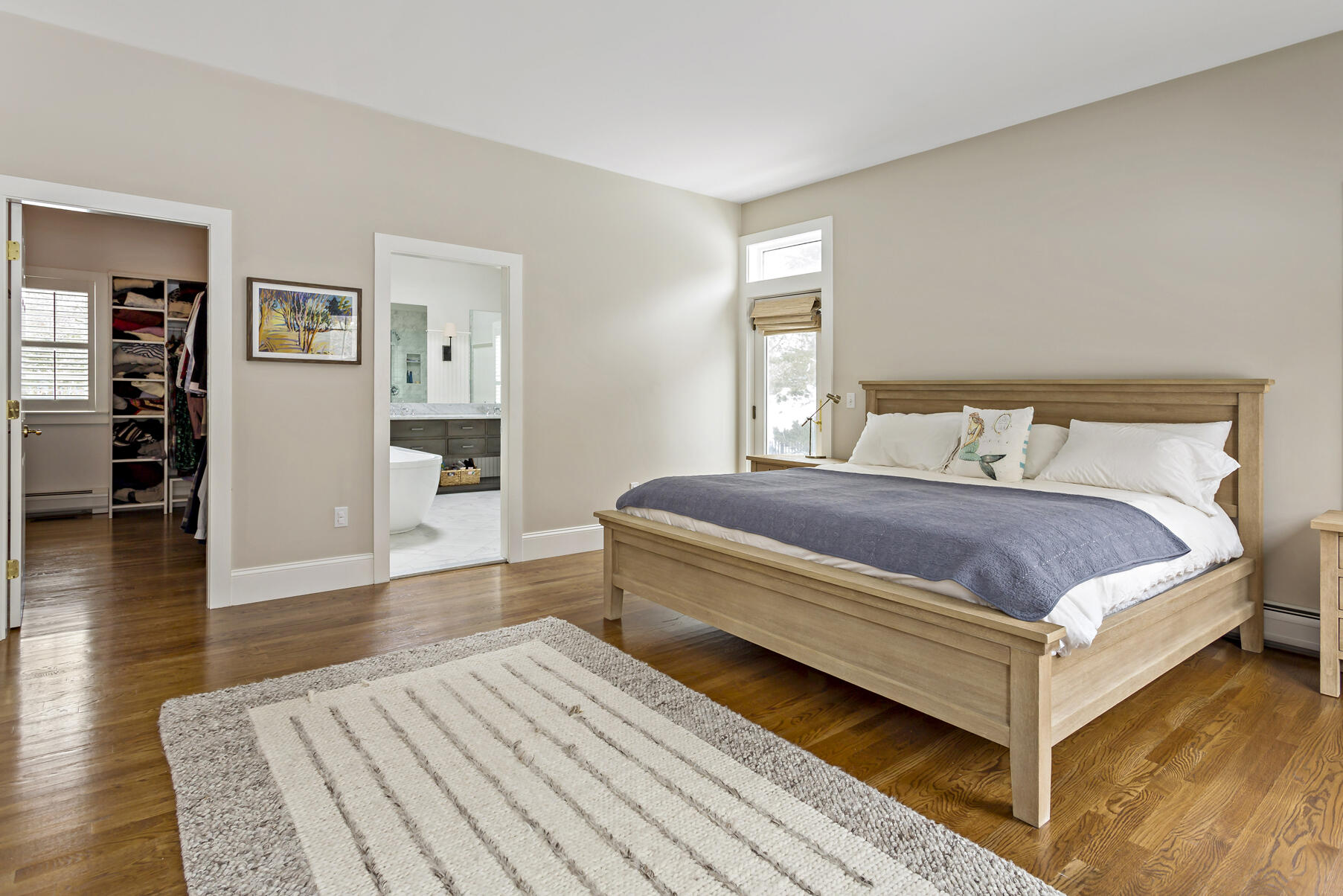 442 Bay Lane Centerville, MA 02632 - Photo 23 of 36 a bedroom with a bed and wooden floor