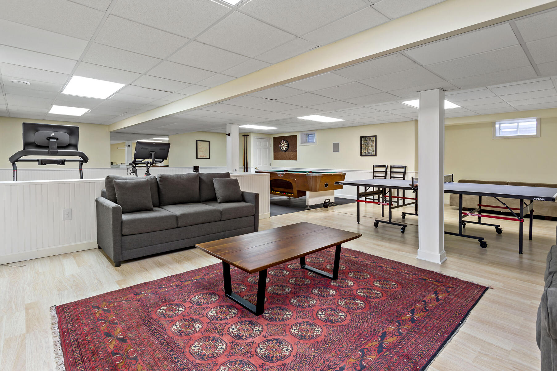 442 Bay Lane Centerville, MA 02632 - Photo 34 of 36 a living room with furniture a wooden floor and a rug
