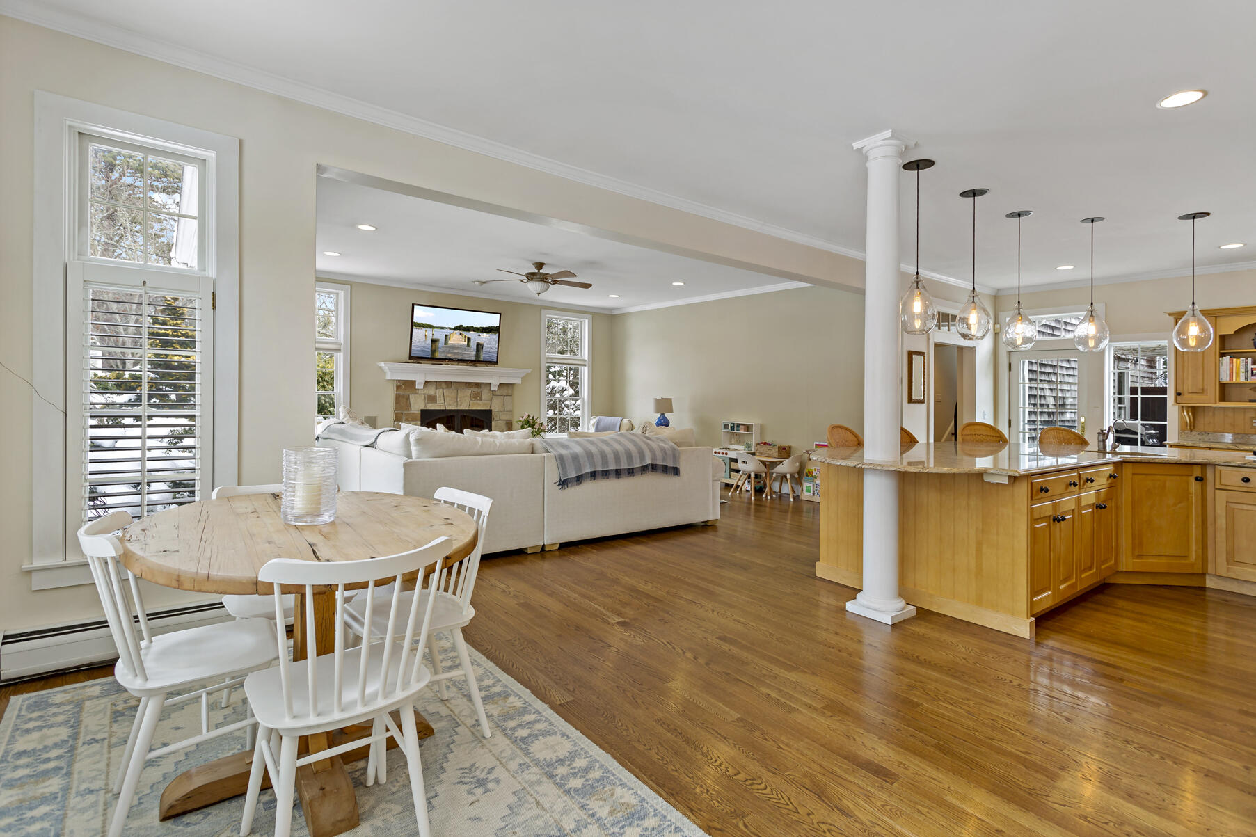 442 Bay Lane Centerville, MA 02632 - Photo 9 of 36 a living room with furniture kitchen view and a wooden floor