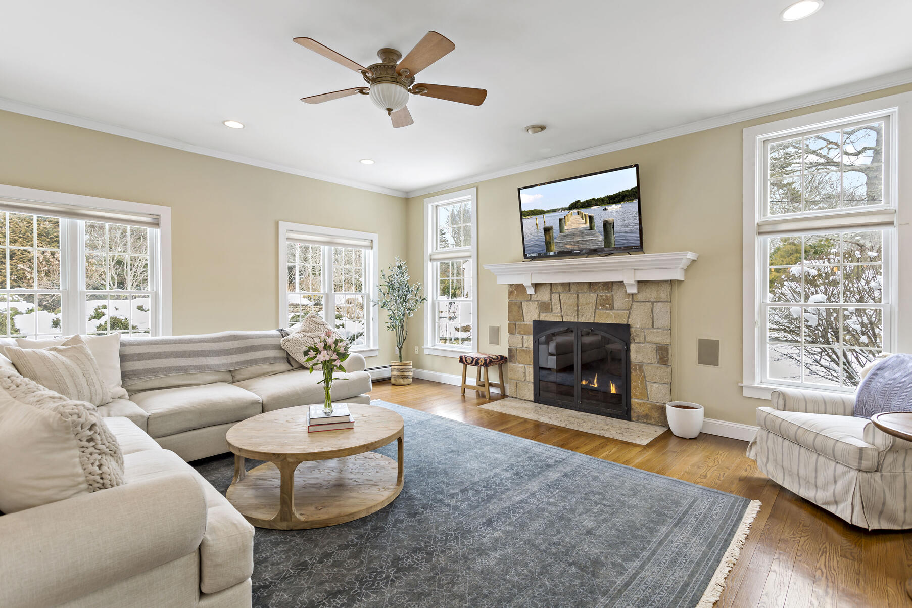 442 Bay Lane Centerville, MA 02632 - Photo 10 of 36 a living room with furniture and a fireplace