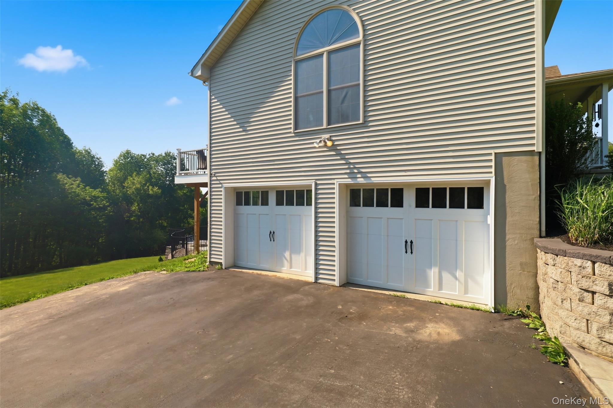233 Devon Farms Road Stormville, NY 12582 - Photo 44 of 48 a front view of a house with a yard and garage