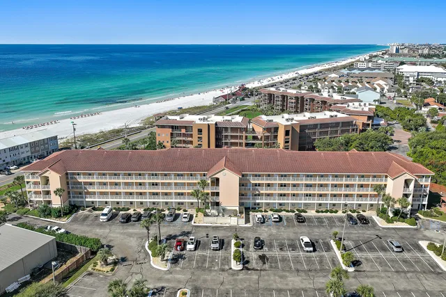 an aerial view of residential building and ocean view