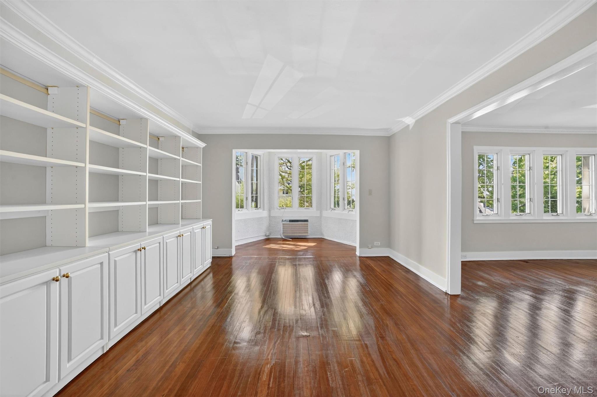 15 Beechtree Lane, Unit 1D Bronxville, NY 10708 - Photo 14 of 41 Large dining room with bookcases and adjacent reading alcove