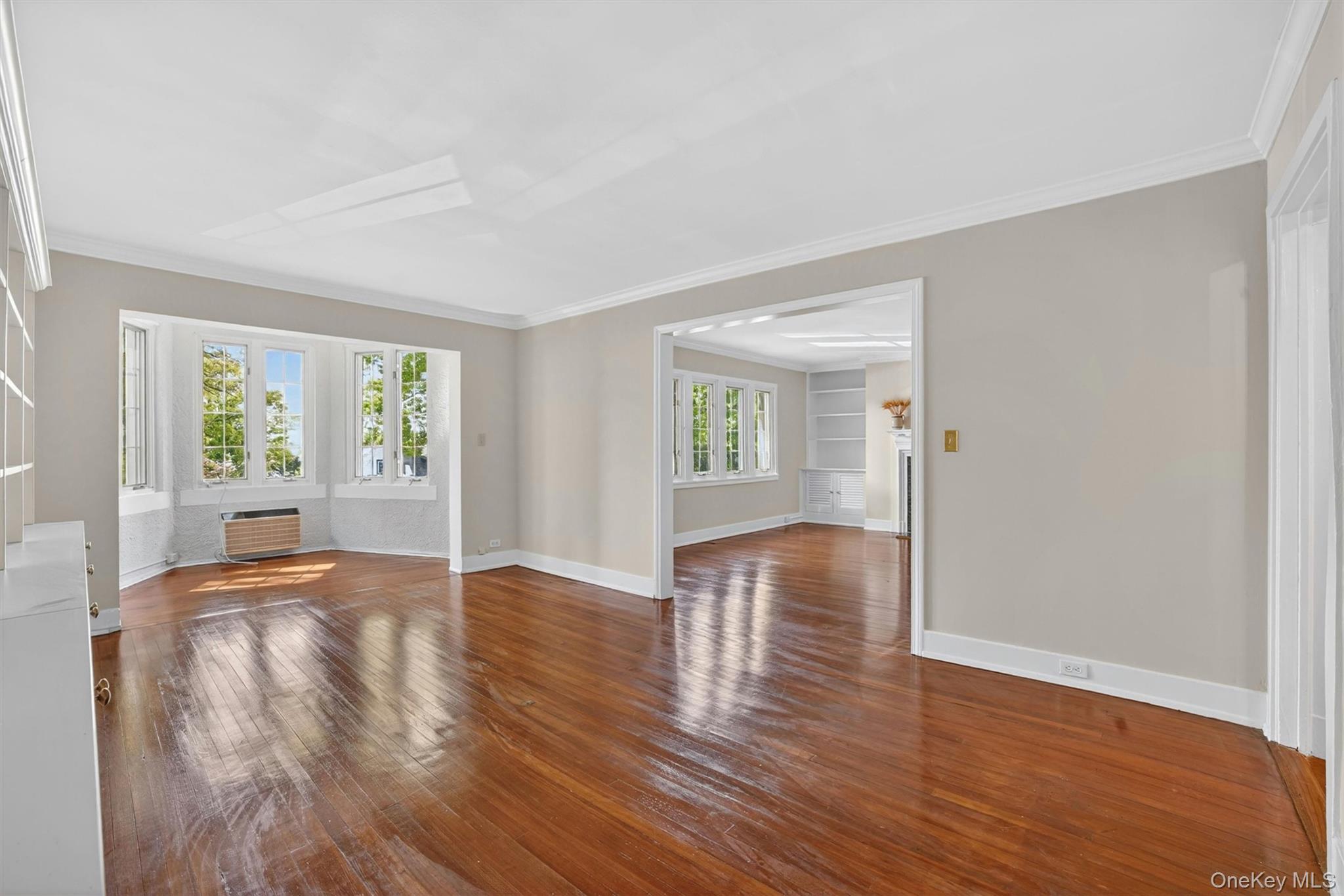 15 Beechtree Lane, Unit 1D Bronxville, NY 10708 - Photo 16 of 41 Large dining room with bookcases and adjacent reading alcove