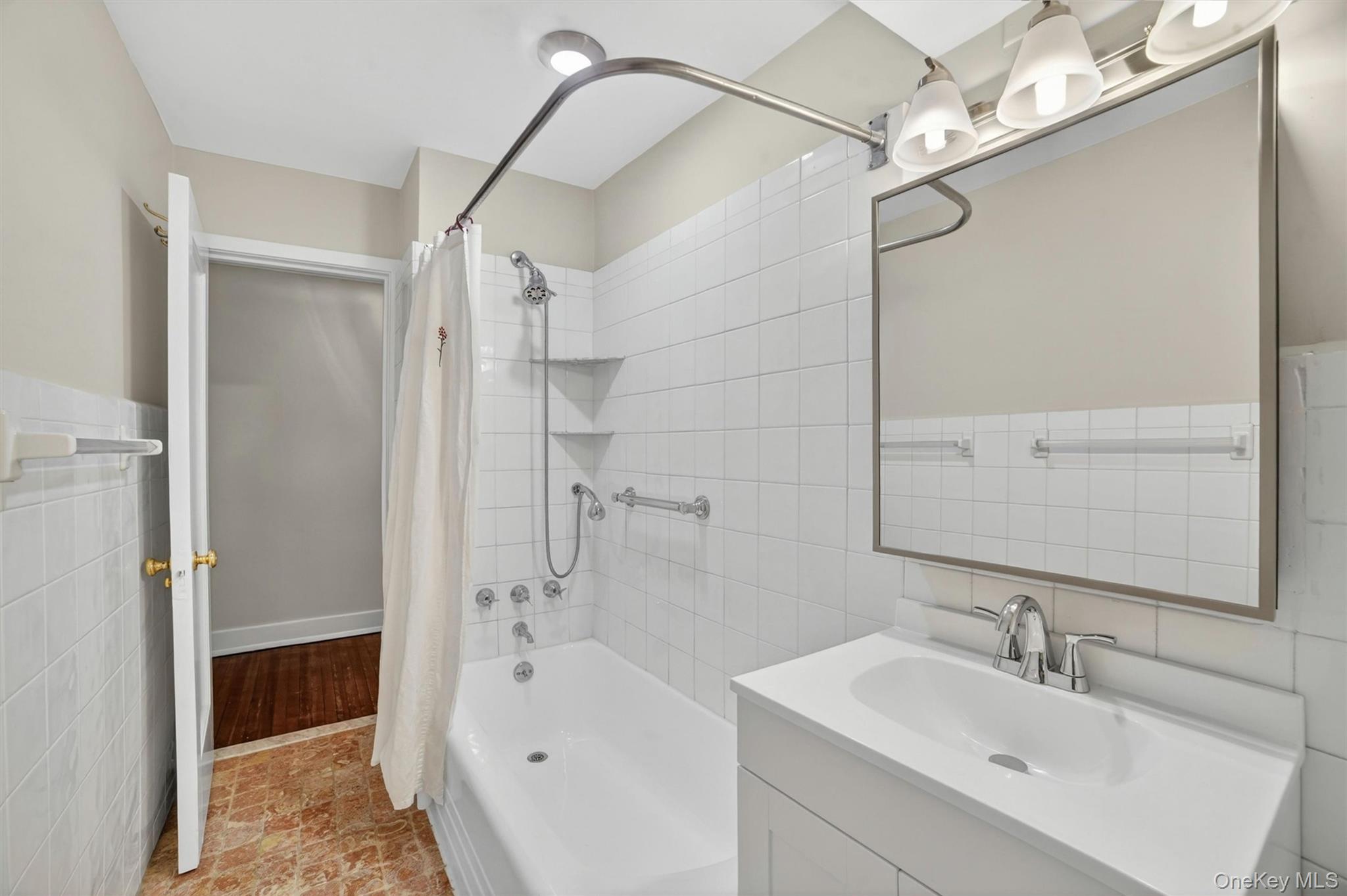 15 Beechtree Lane, Unit 1D Bronxville, NY 10708 - Photo 32 of 41 Bright and clean hall bathroom, new vanity, medicine cabinet and lighting