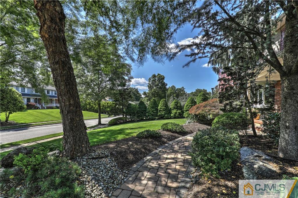23 Winterberry Circle Piscataway, NJ 08854 - Photo 2 of 29 a view of a yard with large tree