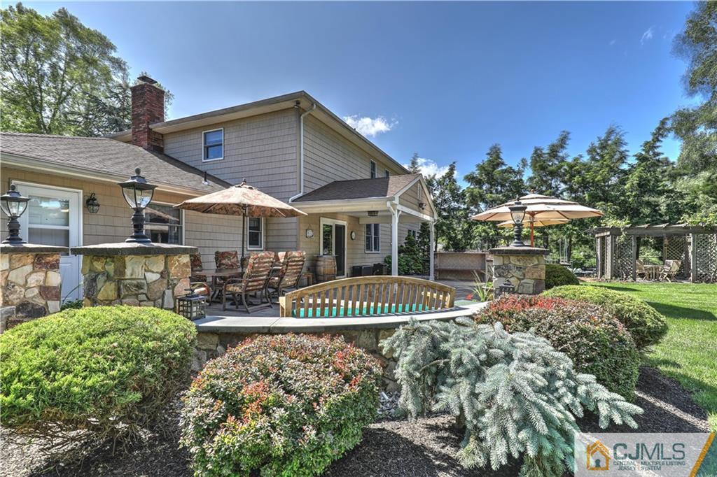 23 Winterberry Circle Piscataway, NJ 08854 - Photo 29 of 29 a front view of a house with a yard table and chairs
