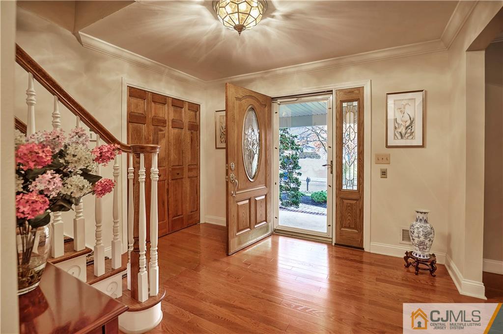 23 Winterberry Circle Piscataway, NJ 08854 - Photo 5 of 29 a view of an entryway with wooden floor and front door