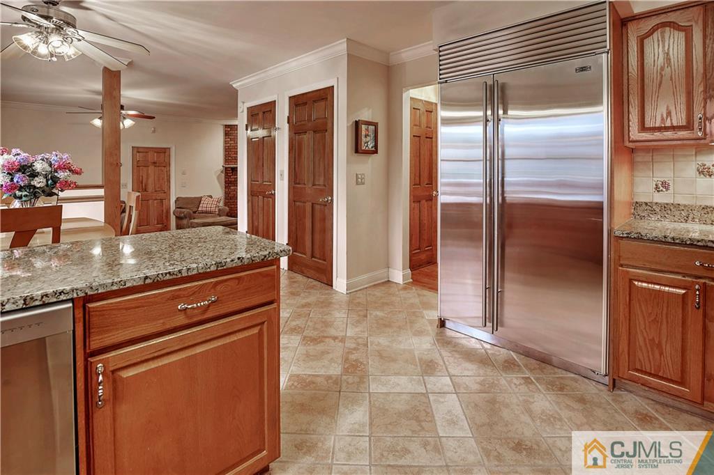 23 Winterberry Circle Piscataway, NJ 08854 - Photo 9 of 29 a kitchen with stainless steel appliances granite countertop a refrigerator and a sink