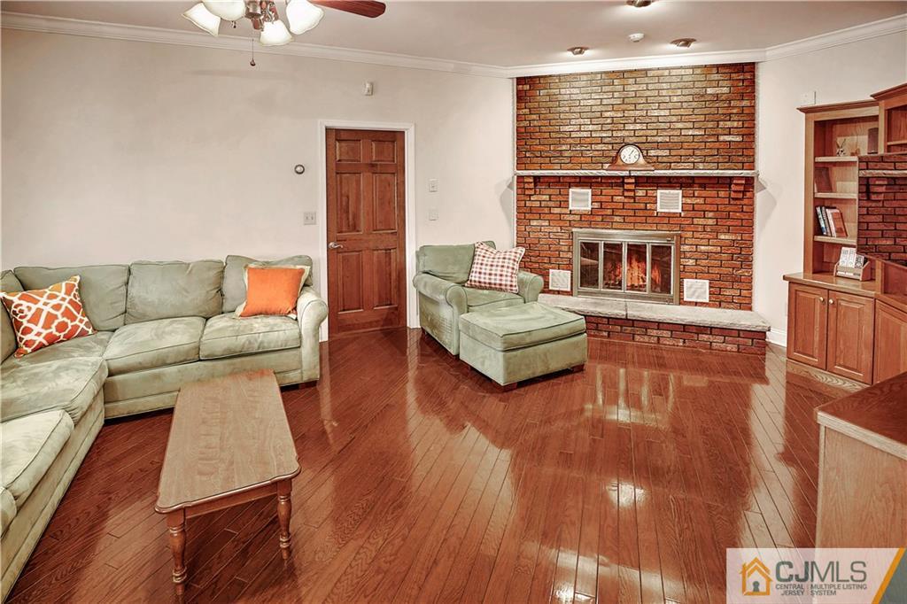 23 Winterberry Circle Piscataway, NJ 08854 - Photo 10 of 29 a living room with fireplace furniture and a large window