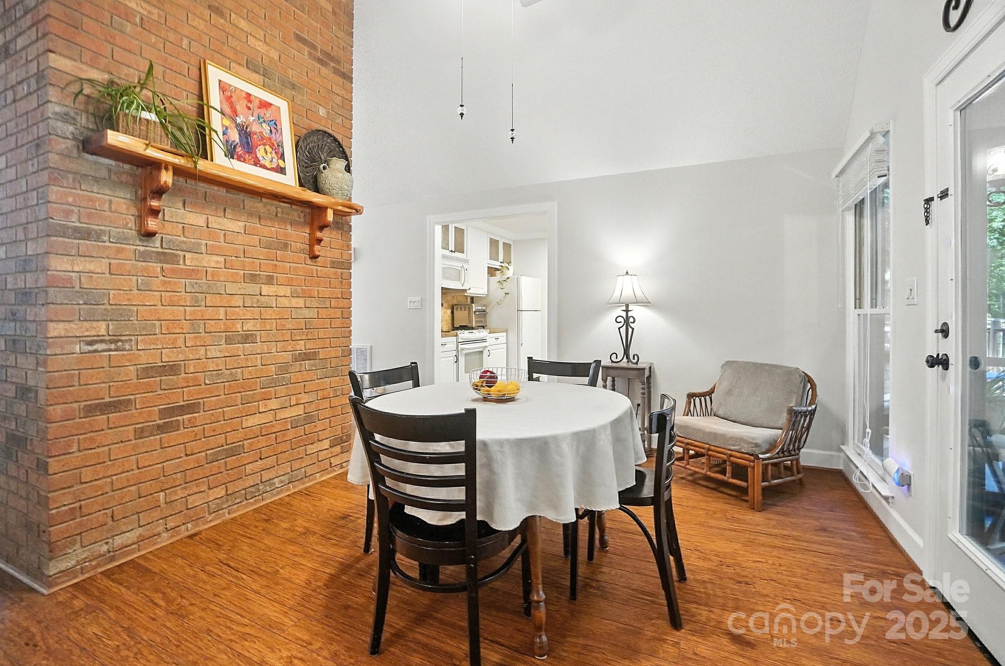 3618 Griffith Road Monroe, NC 28112 - Photo 15 of 48 a view of a dining room with furniture and wooden floor