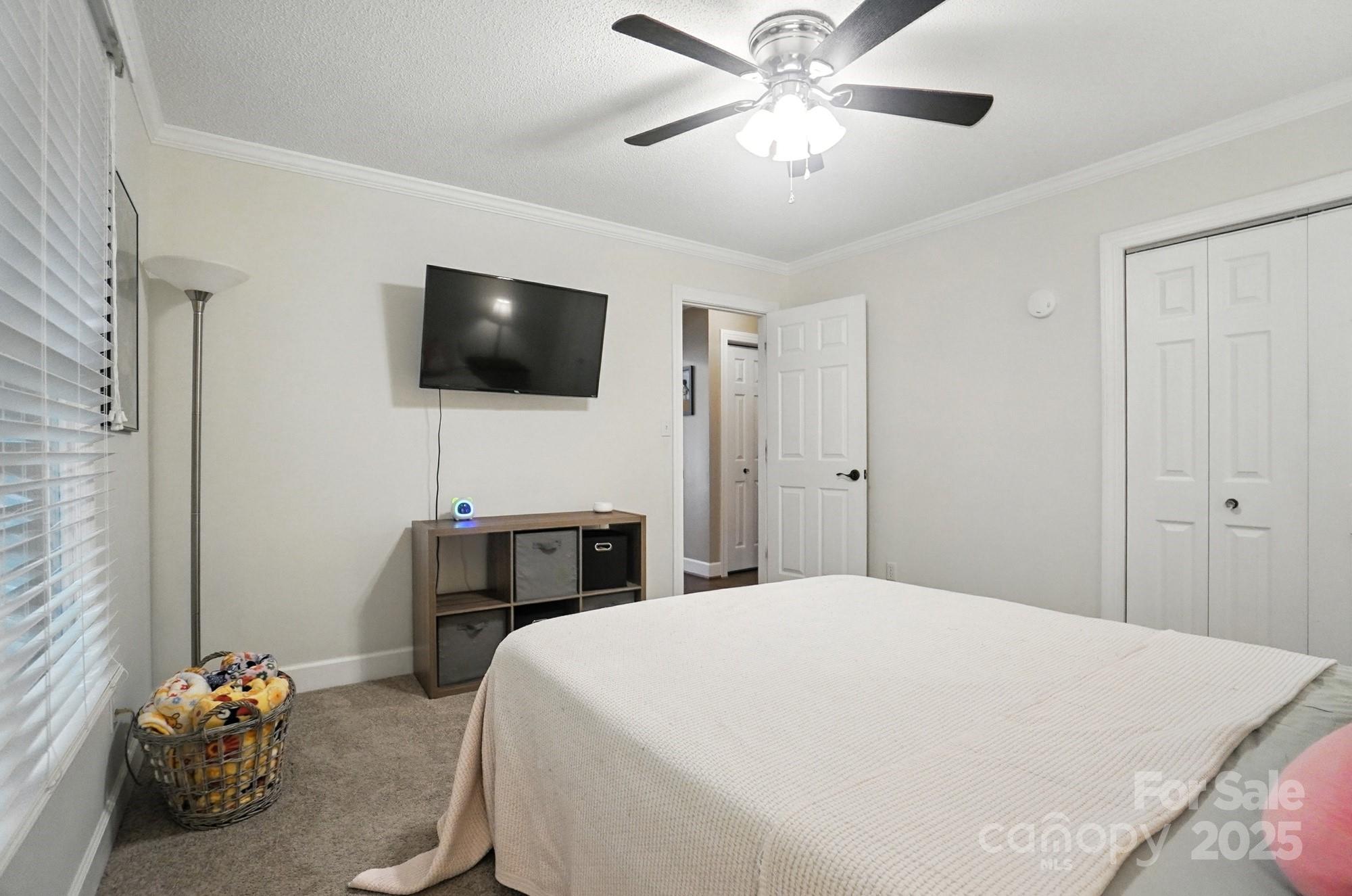 3618 Griffith Road Monroe, NC 28112 - Photo 26 of 48 a bedroom with a bed and a flat screen tv