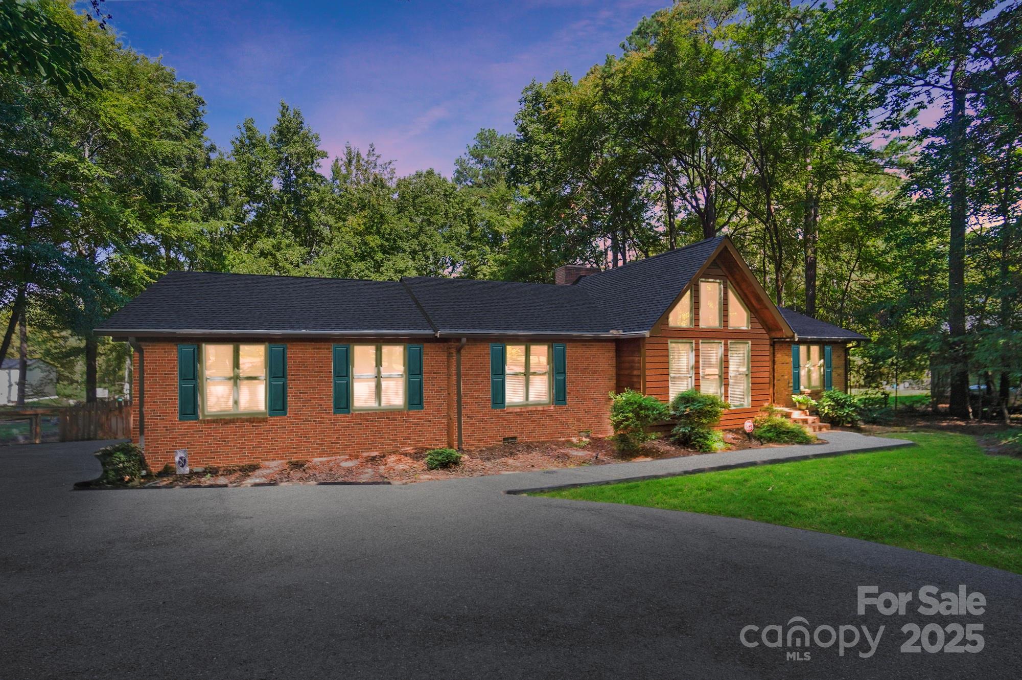 3618 Griffith Road Monroe, NC 28112 - Photo 3 of 48 a front view of a house with a yard and garage