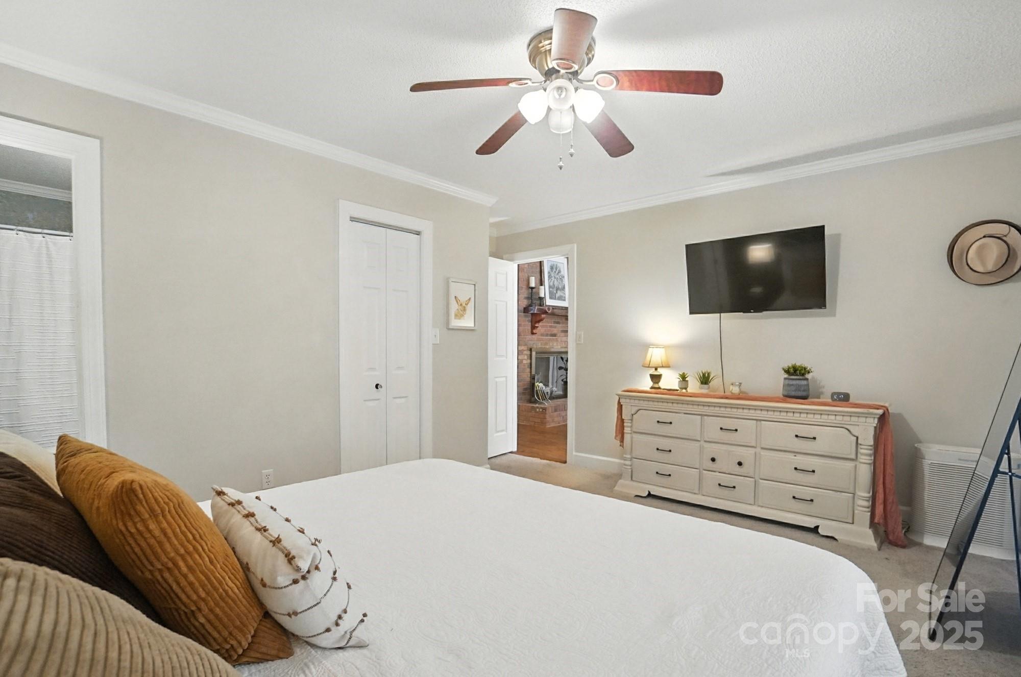 3618 Griffith Road Monroe, NC 28112 - Photo 31 of 48 a bedroom with a bed and a flat screen tv