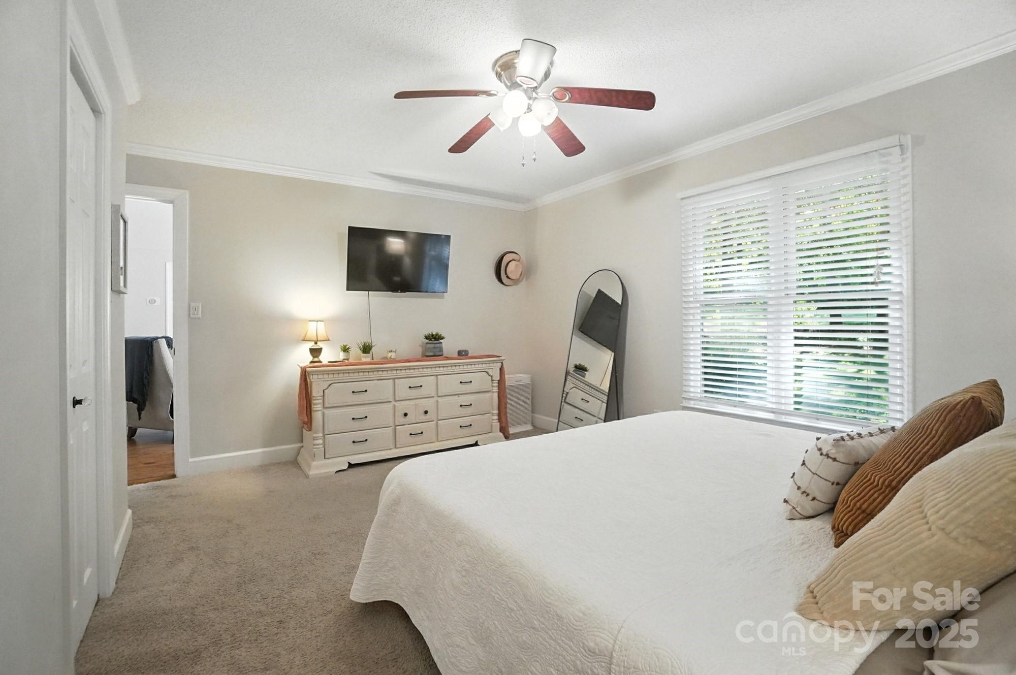 3618 Griffith Road Monroe, NC 28112 - Photo 32 of 48 a bedroom with a bed and a flat screen tv