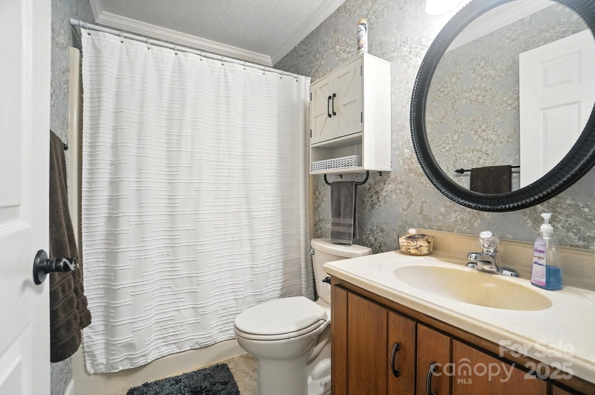 3618 Griffith Road Monroe, NC 28112 - Photo 33 of 48 a bathroom with a sink and a mirror