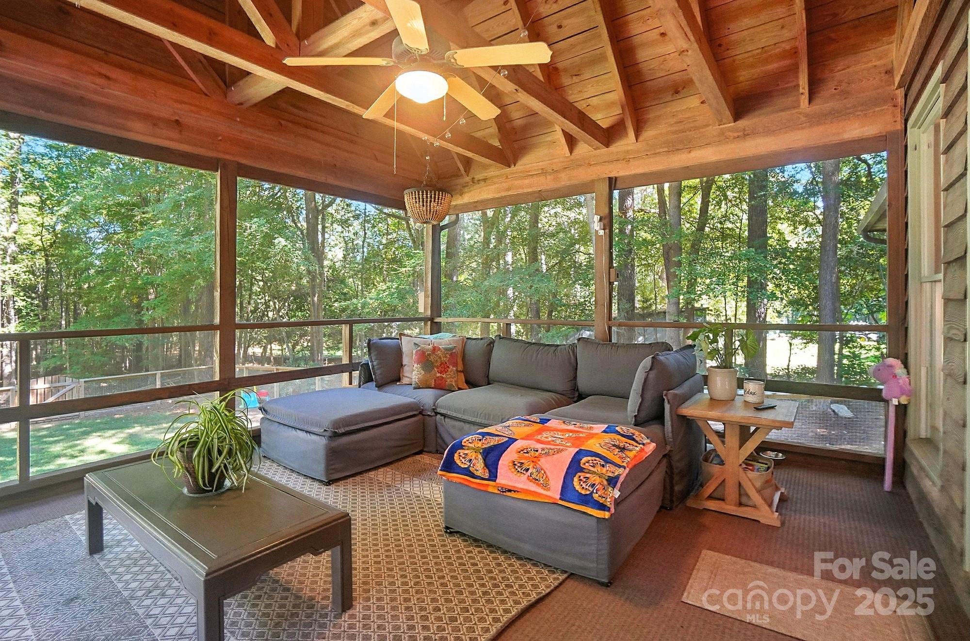 3618 Griffith Road Monroe, NC 28112 - Photo 34 of 48 a living room with furniture a ceiling fan and a large window