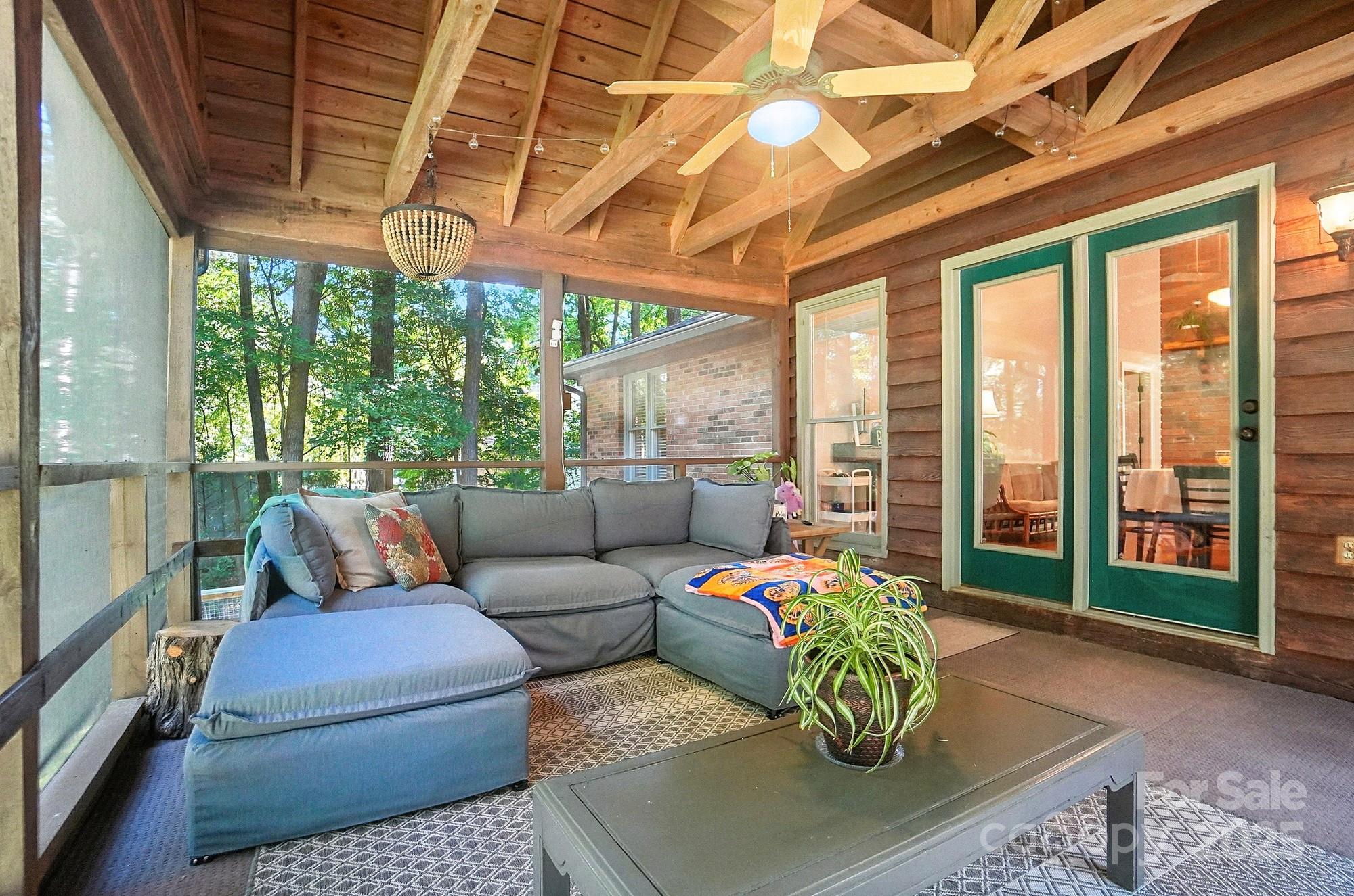 3618 Griffith Road Monroe, NC 28112 - Photo 35 of 48 a living room with patio furniture and a floor to ceiling window