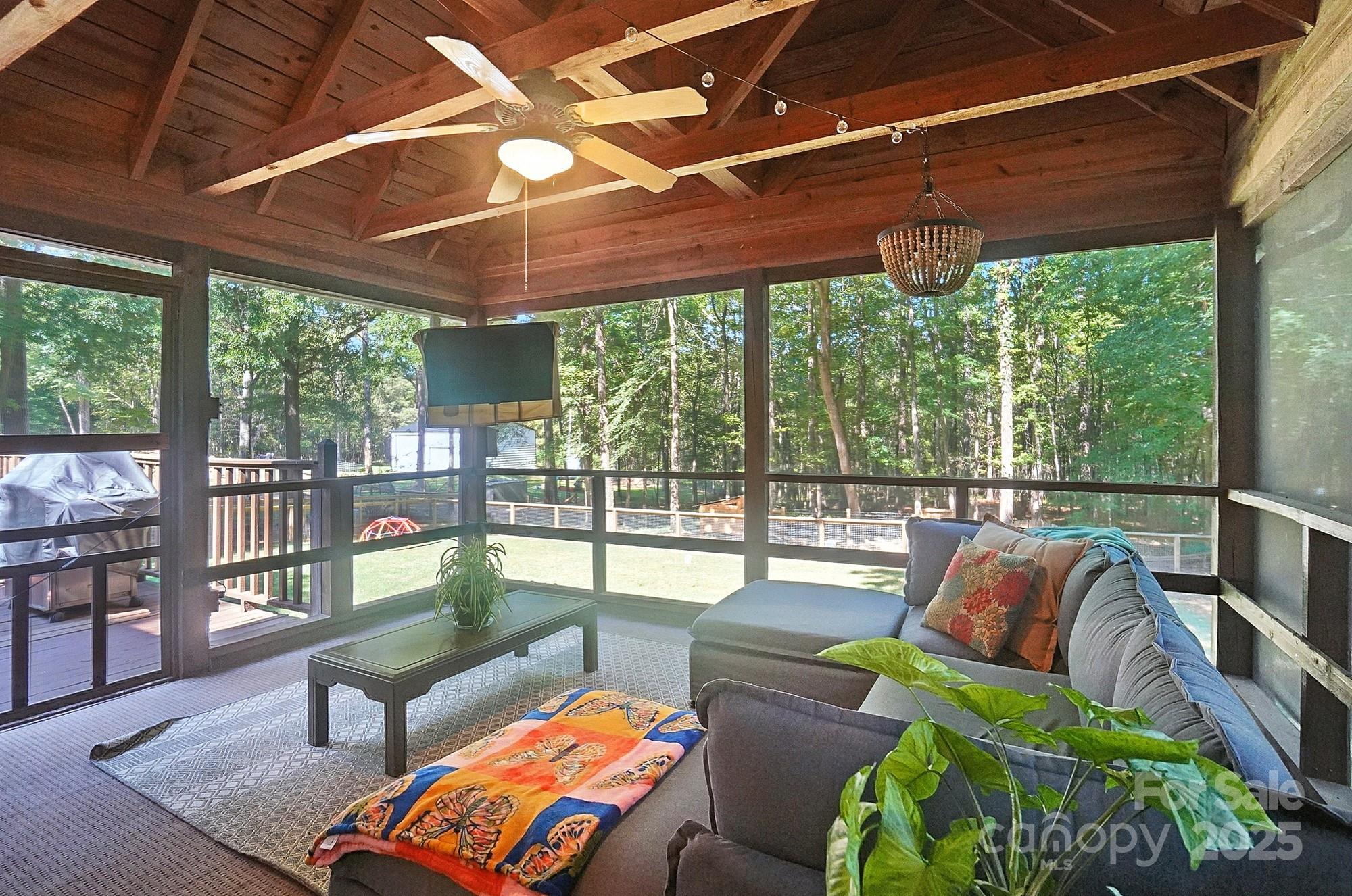 3618 Griffith Road Monroe, NC 28112 - Photo 36 of 48 a view of a patio with couches chairs and wooden floor