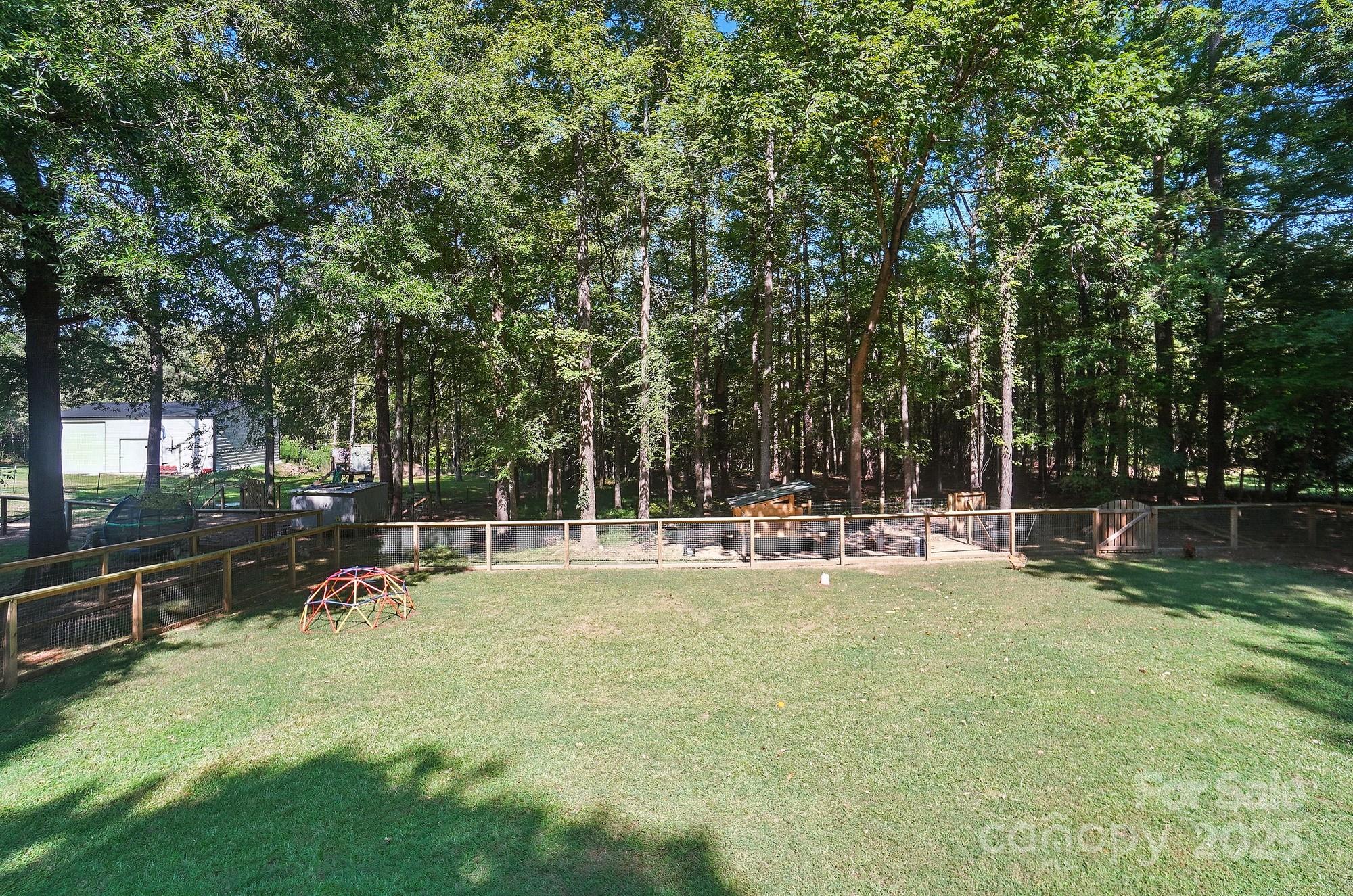 3618 Griffith Road Monroe, NC 28112 - Photo 40 of 48 a view of a swimming pool with a table and chairs