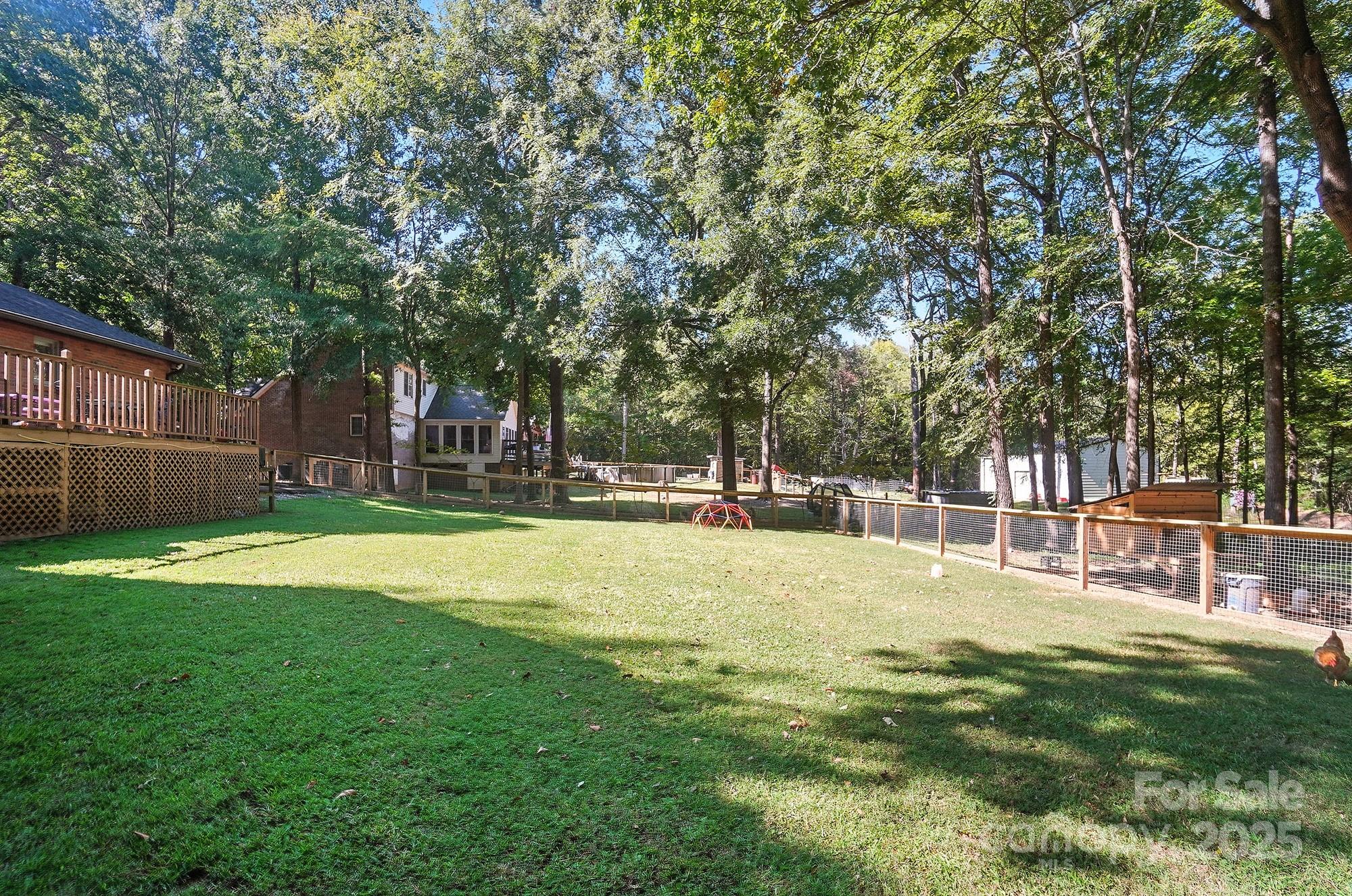3618 Griffith Road Monroe, NC 28112 - Photo 44 of 48 a swimming pool with outdoor seating and yard