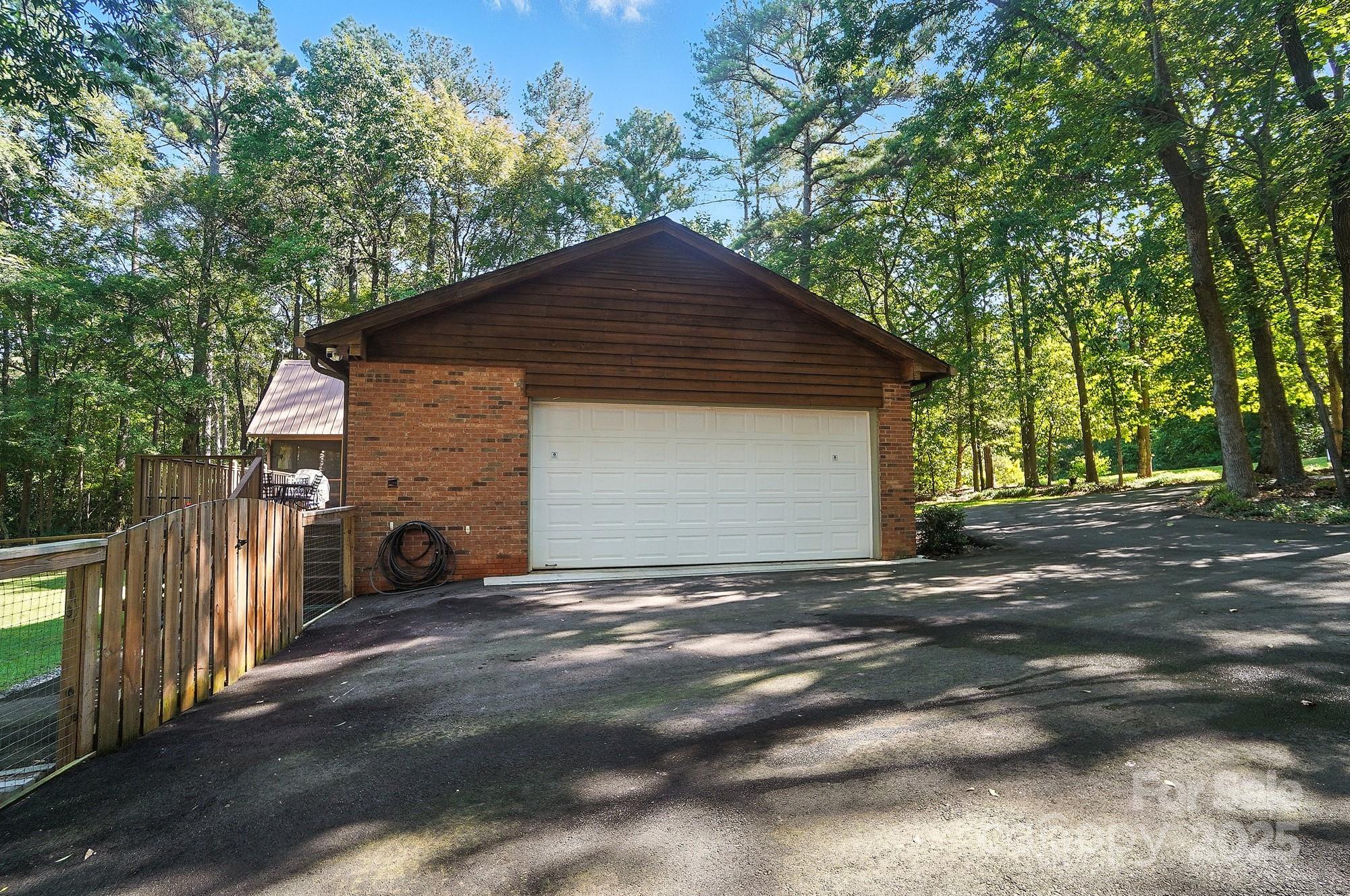 3618 Griffith Road Monroe, NC 28112 - Photo 47 of 48 a front view of a house with a yard and garage