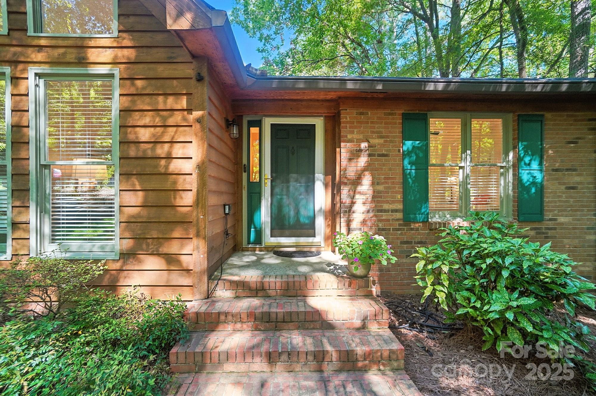 3618 Griffith Road Monroe, NC 28112 - Photo 5 of 48 a front view of a house with a yard