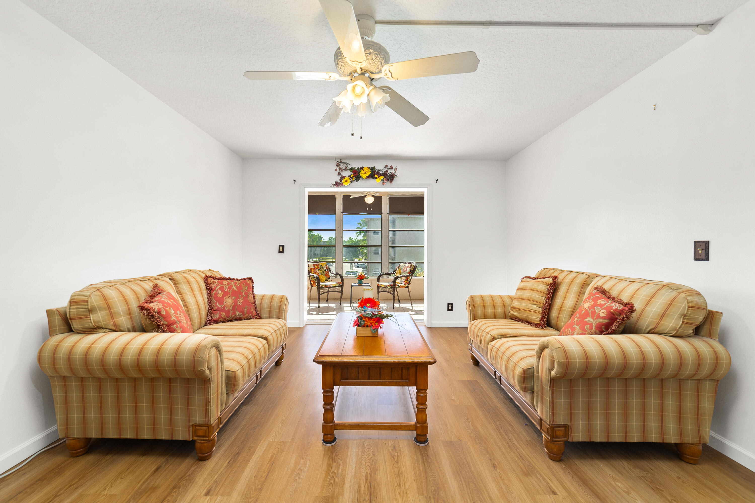 230 Northeast 26th Avenue, Unit 3020 Boynton Beach, FL 33435 - Photo 16 of 44 a living room with furniture and a couch