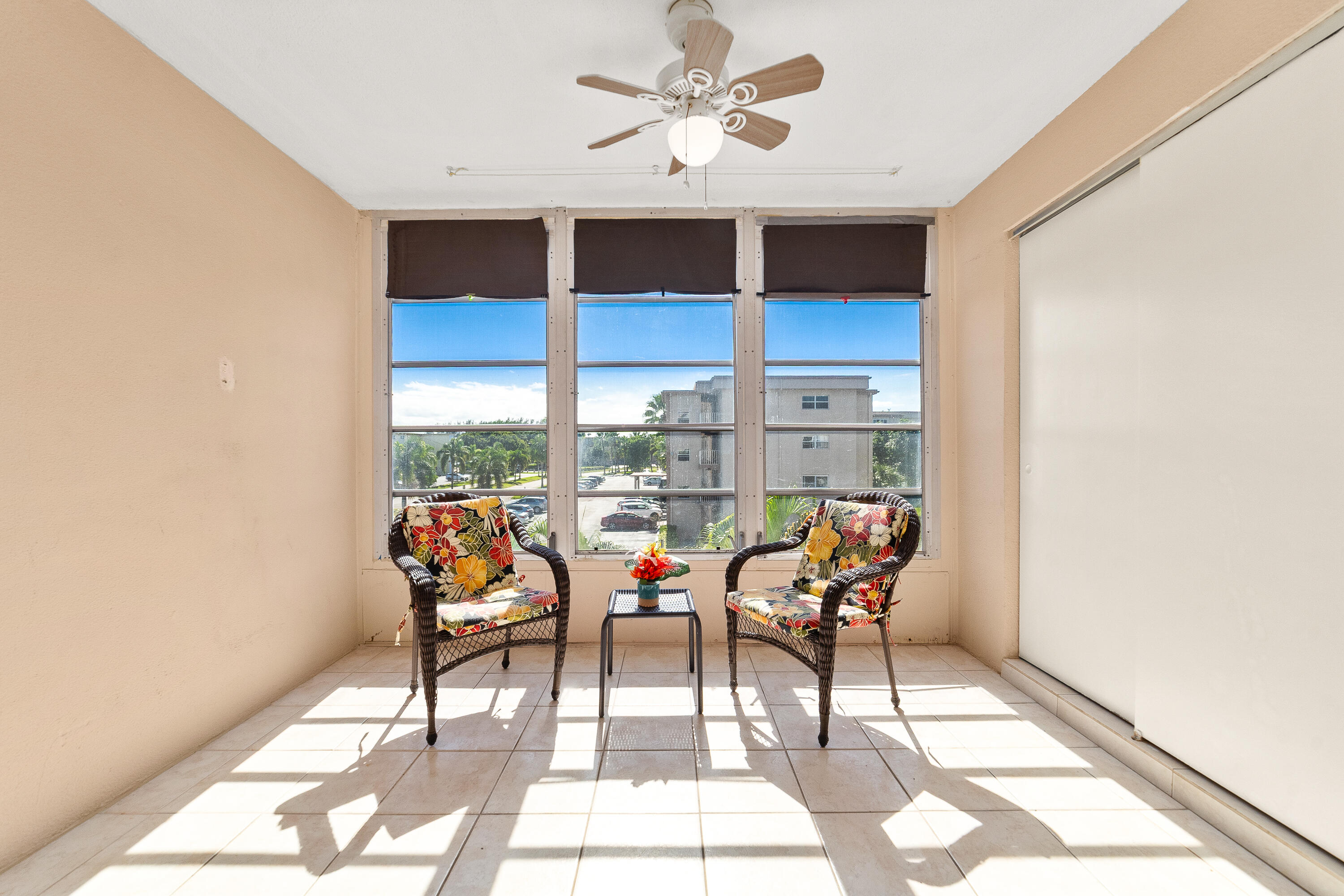 230 Northeast 26th Avenue, Unit 3020 Boynton Beach, FL 33435 - Photo 20 of 44 a group of chairs sitting in a living room next to a window