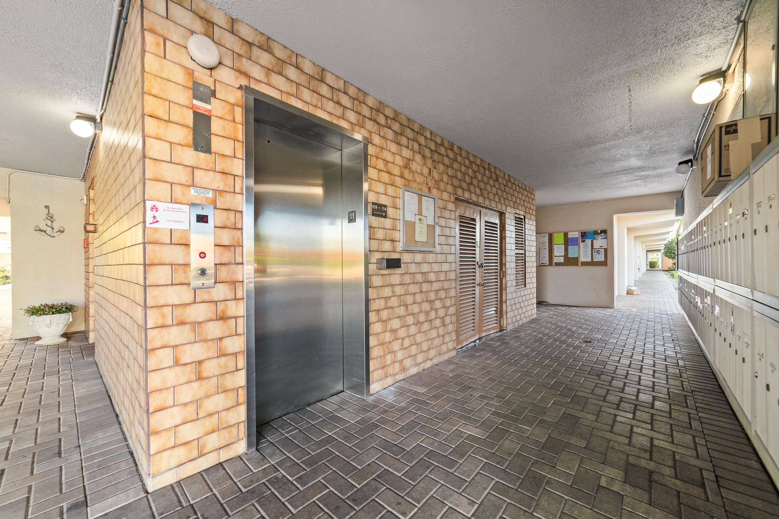 230 Northeast 26th Avenue, Unit 3020 Boynton Beach, FL 33435 - Photo 2 of 44 a view of entryway with stairs