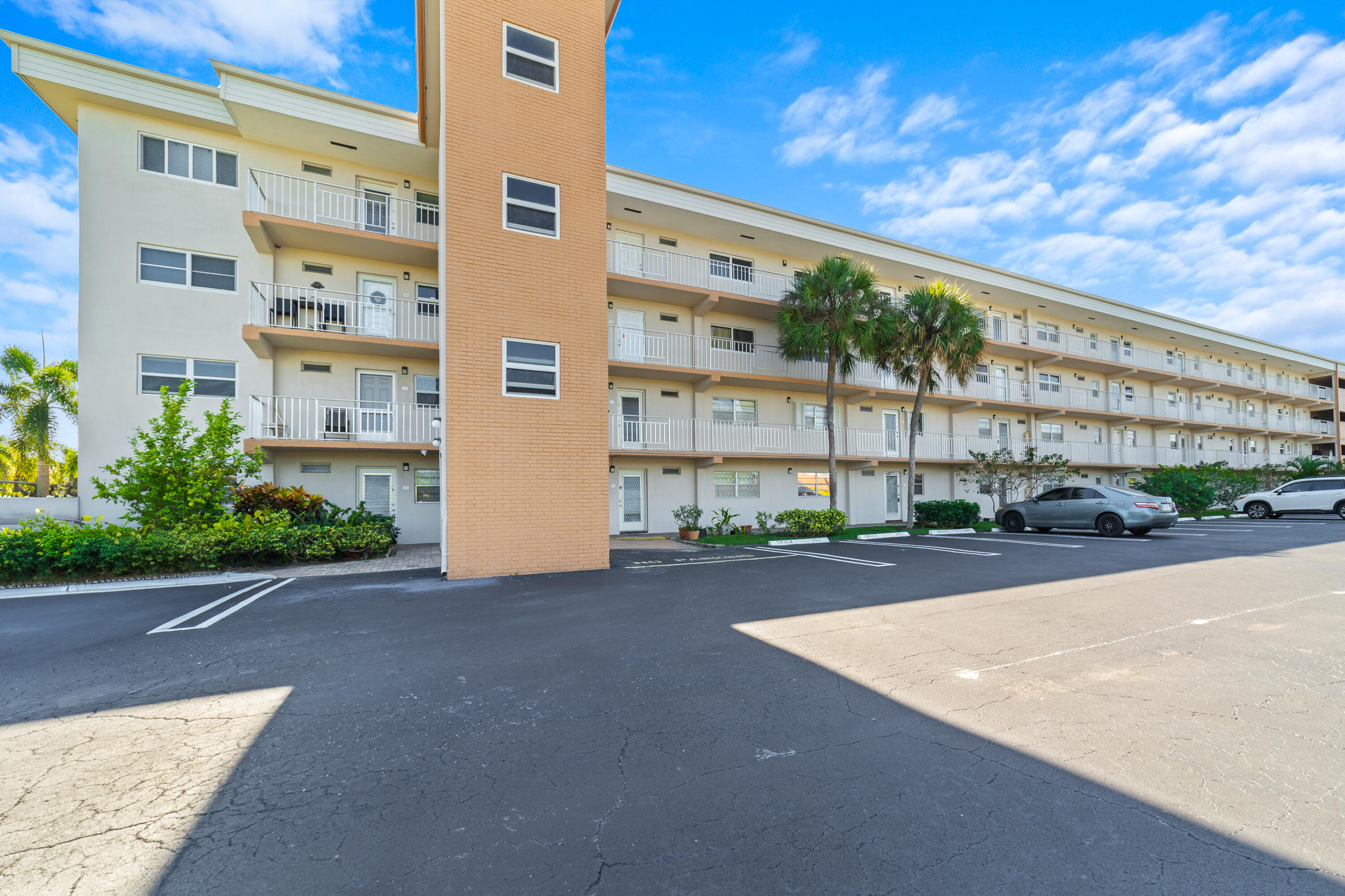 230 Northeast 26th Avenue, Unit 3020 Boynton Beach, FL 33435 - Photo 24 of 44 a view of a building with a street