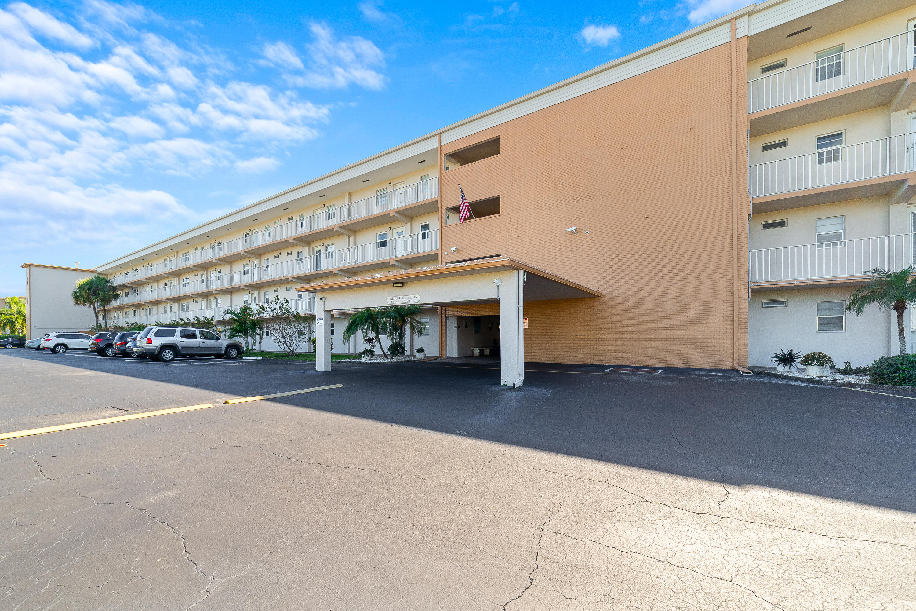 230 Northeast 26th Avenue, Unit 3020 Boynton Beach, FL 33435 - Photo 25 of 44 a large building with a street